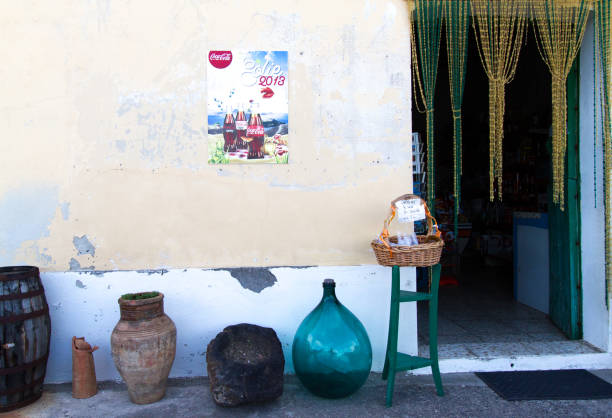 Salina, Aeolian Islands, Sicily: Doorway to Small Market, Beaded Curtain Salina, Aeolian Islands, Sicily: A doorway to a small market with beaded curtains and pots out front in Lingua, a village in southern Salina. salina sicily stock pictures, royalty-free photos & images