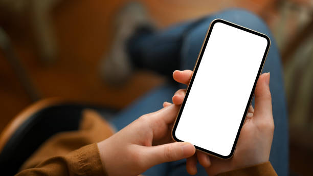 istock Close-up, Female hands holding cellphone, phone mockup. 1378426771