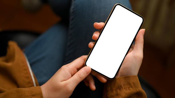 Close-up, focus hands, Female in casual outfit, using smartphone.