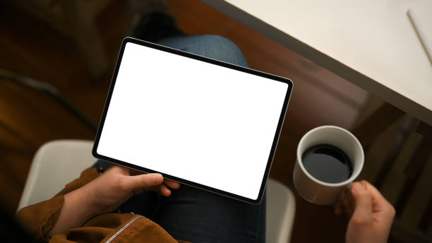 istock Female relaxing at home, looking some content on the internet via tablet 1378429407