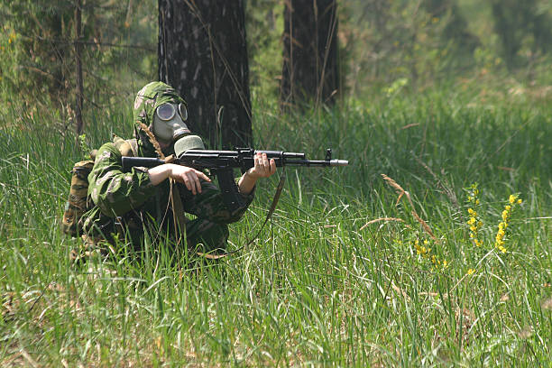 istock Soldier in gas mask with Kalashnikov 137843228