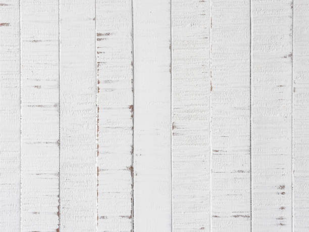 istock Old worn, weathered, white painted vertical wood paneling background. 1378442980