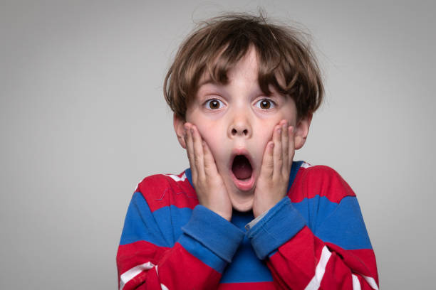 istock Surprised little boy looking at the camera 1378443602