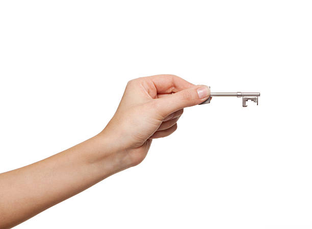 woman's hand with a key stock photo