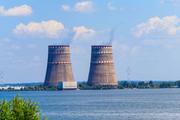 Cooling towers of Zaporizhia Nuclear Power Station in Enerhodar Cooling towers of Zaporizhia Nuclear Power Station in Enerhodar, Ukraine dnieper river stock pictures, royalty-free photos & images