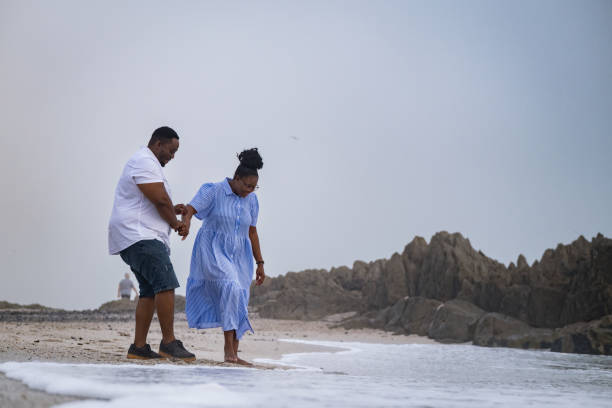 istock African couple enjoying time on the beach. 1378511063