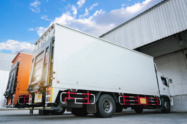 istock Cargo Container Trucks on the Parking at Distribution Warehouse. Shipping Trucks. Freight Trucks Cargo Transport Logistics. 1378532462
