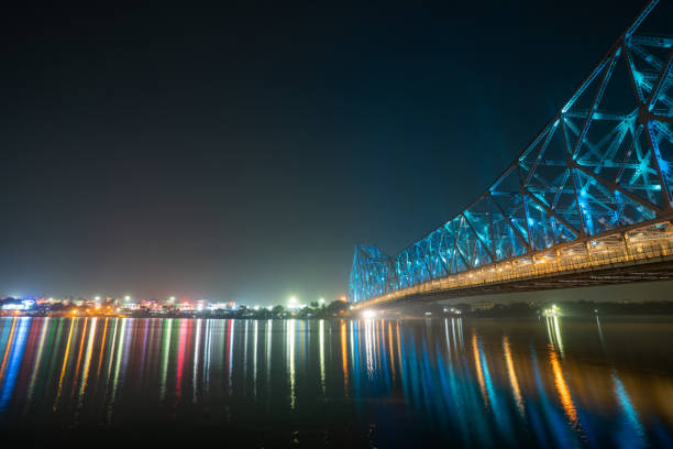 istock Howrah bridge on the river Hooghly with the twilight sky. Cantilever bridge is considered as the busiest bridge in India. 1378537100