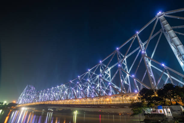 istock Howrah bridge on the river Hooghly with the twilight sky. Cantilever bridge is considered as the busiest bridge in India. 1378537101