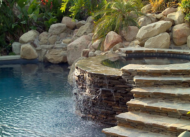 pool and hot tub A backyard swimming pool. hardscape photos stock pictures, royalty-free photos & images
