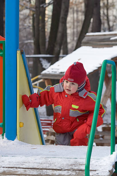istock little girl rises on an ice slope 137855079