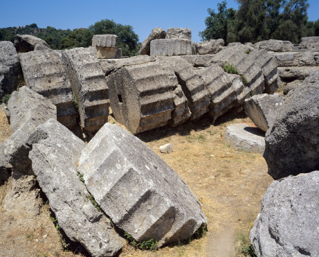 The ruined doric pillars of the Temple of Zeus at ancient Olympia (location of the Ancient Olympic Games)