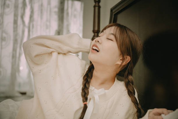 istock Happy asian girls in bed 1378566535