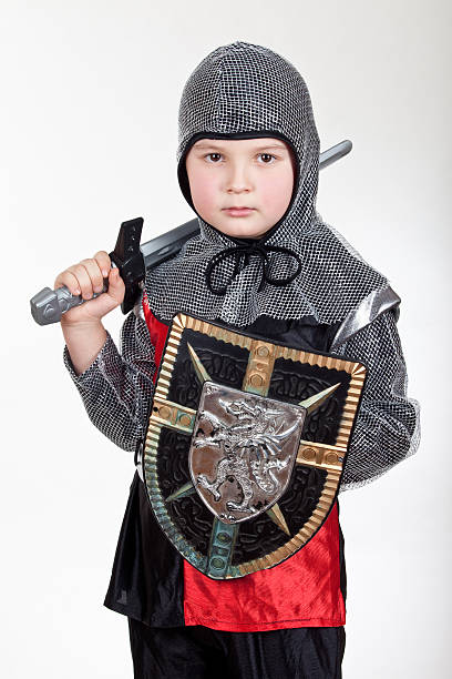 istock Boy in knight wear look at you 137858598