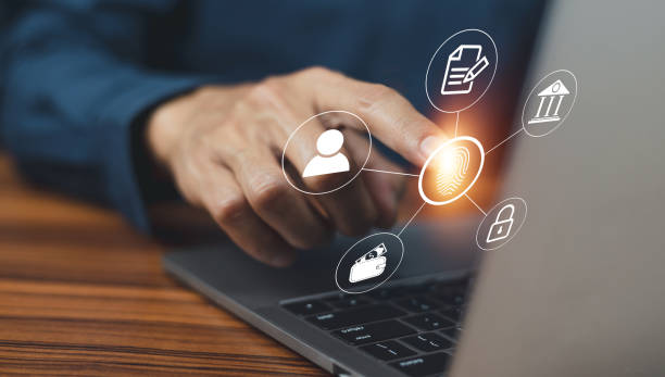 istock Businessman scans fingerprint to unlock security system Internet storage and financial systems Banking and personal information 1378590198