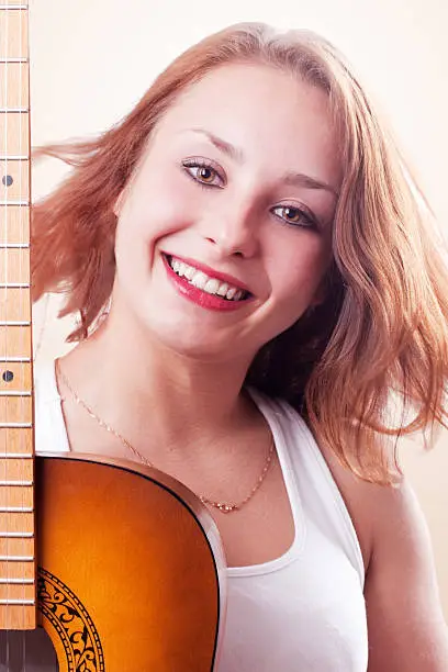 Photo of Beautiful girl posing with guitar