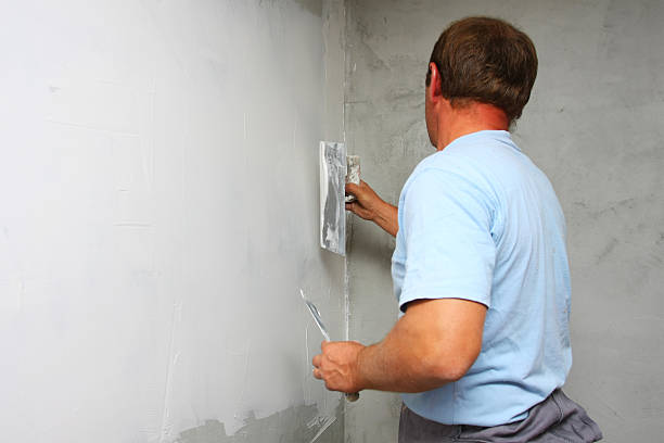 istock House painter is polishing the wall 137861442