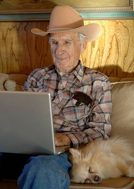 Senior Man with Laptop Computer stock photo