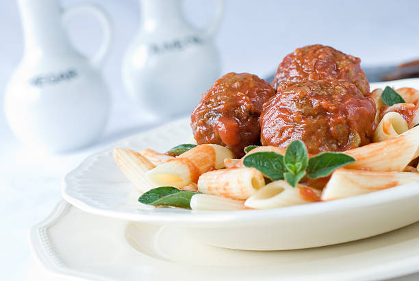 Pasta Meatballs Pasta Meatballs penne meatballs stock pictures, royalty-free photos & images