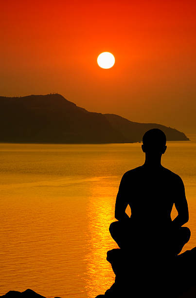 istock Silhouette of the meditating person 137864178