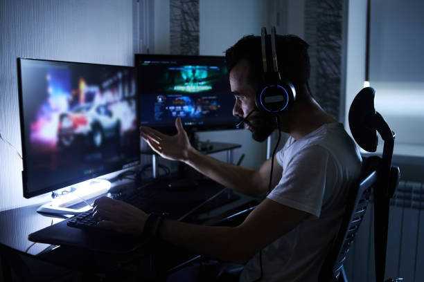 istock a young 30-year-old gamer is sitting at a computer, playing computer games, nervous, angry, worried.selective focus with low depth of focus 1378672059