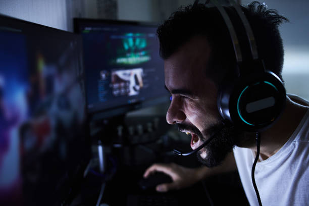 istock a young 30-year-old gamer is sitting at a computer, playing computer games, nervous, angry, worried.selective focus with low depth of focus 1378676449