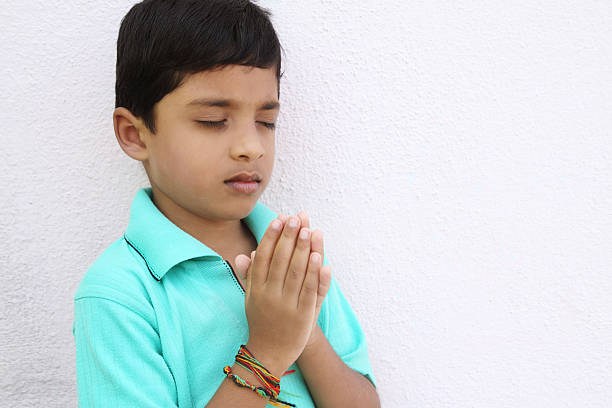 istock Indian Little Boy Praying 137870979