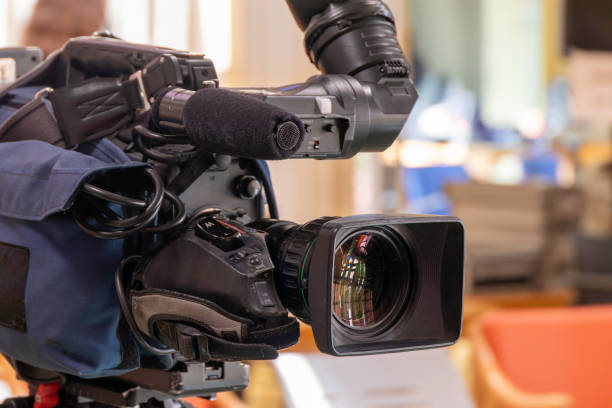 istock Professional TV video camera on a tripod. Close up. Selective focus 1378721118