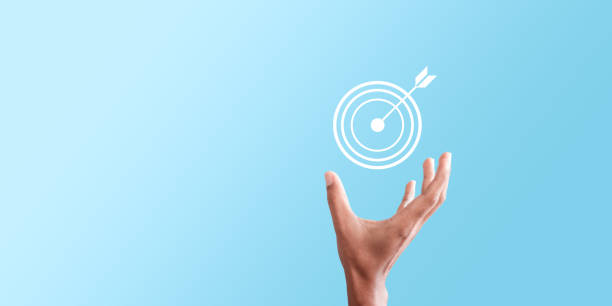 istock Businessman holding virtual dartboard and arrow 1378728113