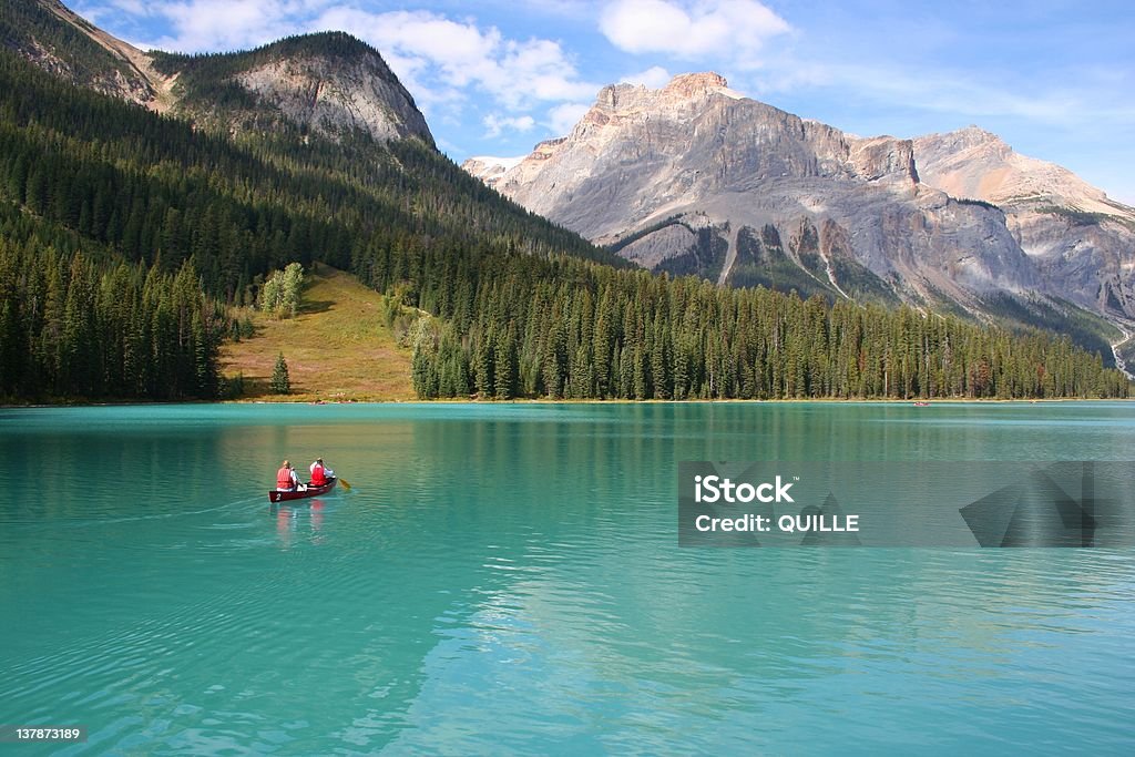 Canoeists on Emerald Lake Canoeists on Emerald Lake in the Canadian Rockies Canoeing Stock Photo