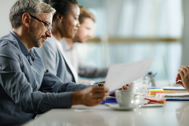 istock Businessman analyzing reports on a meeting in the office. 1378734112