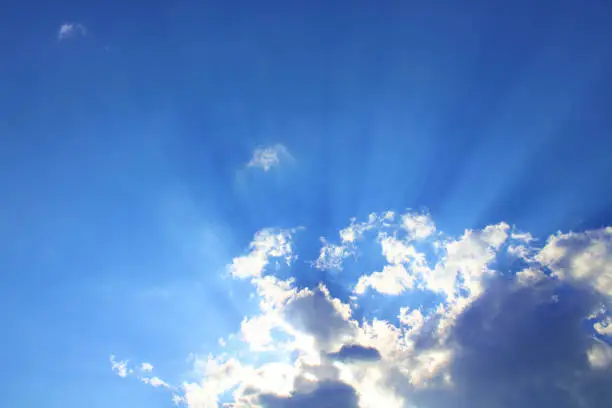 Photo of The sun's rays appear through the clouds. Close-up. Background. Landscape.