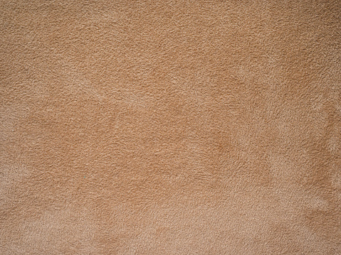 beige faux suede closeup - horizontal textile background