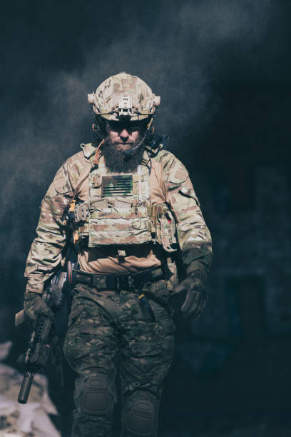 istock A bearded soldier in a special forces uniform walks through an abandoned building after a successful mission. Selection focus 1378766560