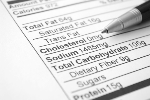 Close-up of nutrition facts black & white document with pen