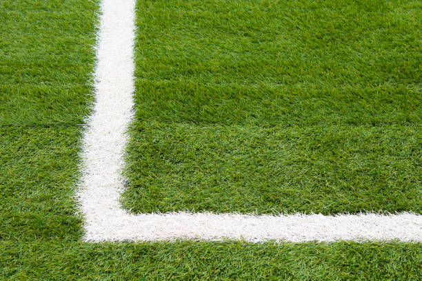 istock Artificial grass on the football field. Close-up. Background. Texture. 1378796872