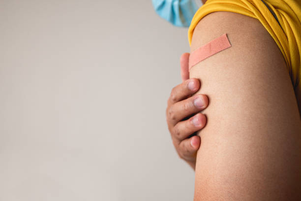 istock Someone gets Coronavirus vaccine and COVID-19 side effect coverage endorsement. Copy space for text, graphic. 1378798511