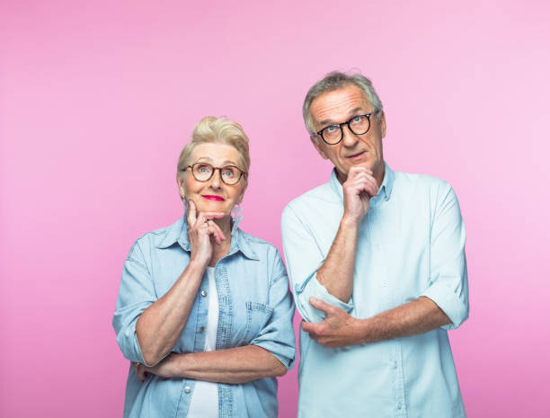 istock Thoughtful senior woman and man looking up 1378807740
