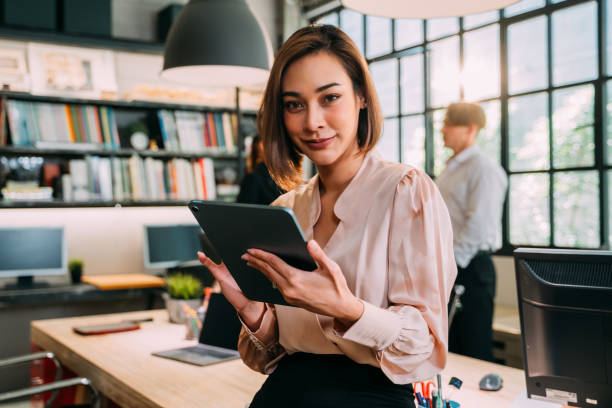 istock Woman in office working on digital tablet 1378826114