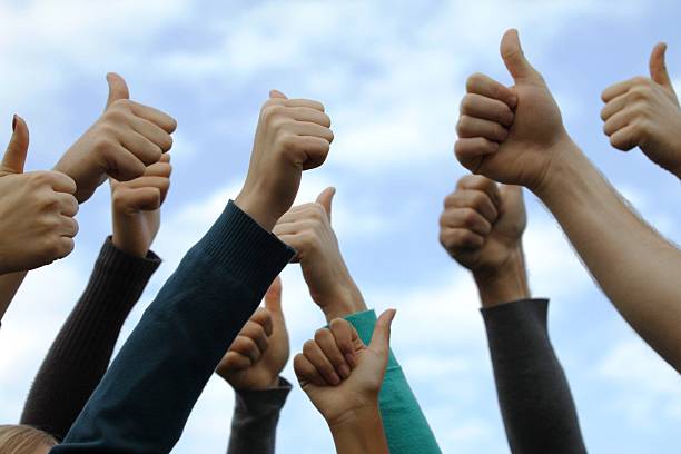 istock hands with thumbs up to the sky 137884787