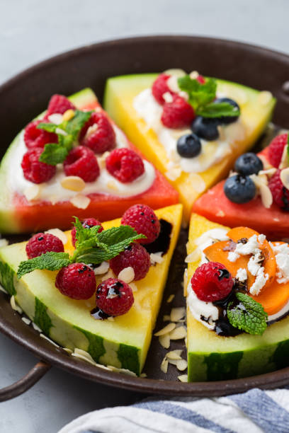 istock Watermelon pizza with berries, fruit, yogurt, feta cheese 1378854083