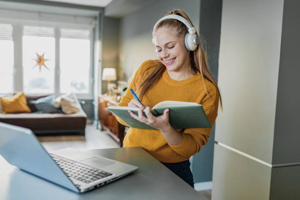 istock A young cheerful woman attends interactive online classes 1378866648