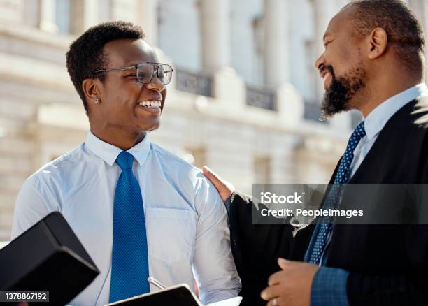 Shot Of Two Lawyers Talking In The City Stock Photo - Download Image Now - Mentorship, African Ethnicity, Legal System