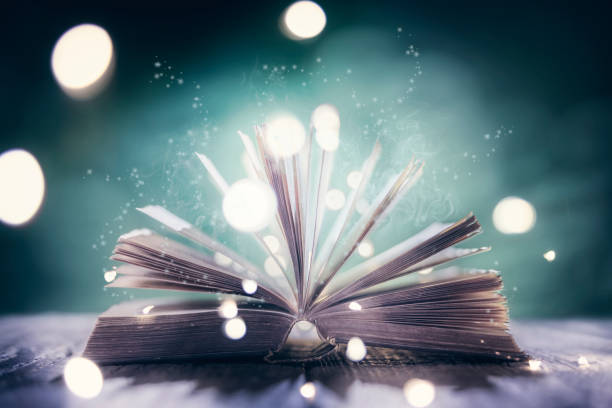 istock Old book or Holy Bible open on a table background 1378873145