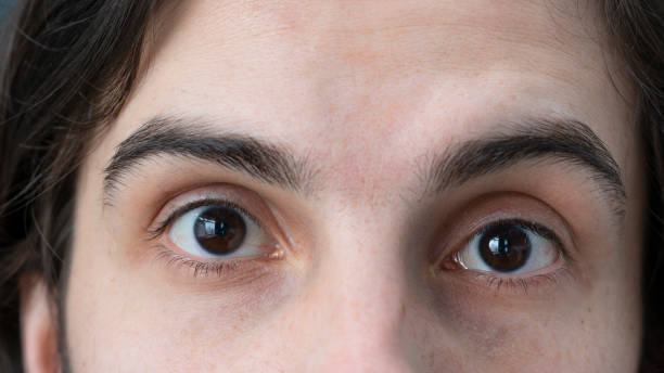 istock Close-up of surprised or scared man looking at camera 1378878540