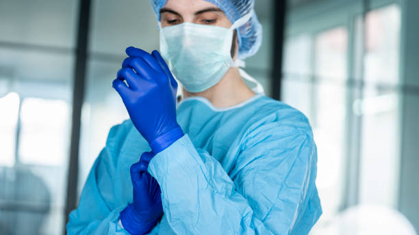 istock Doctor putting on protective blue gloves 1378881713
