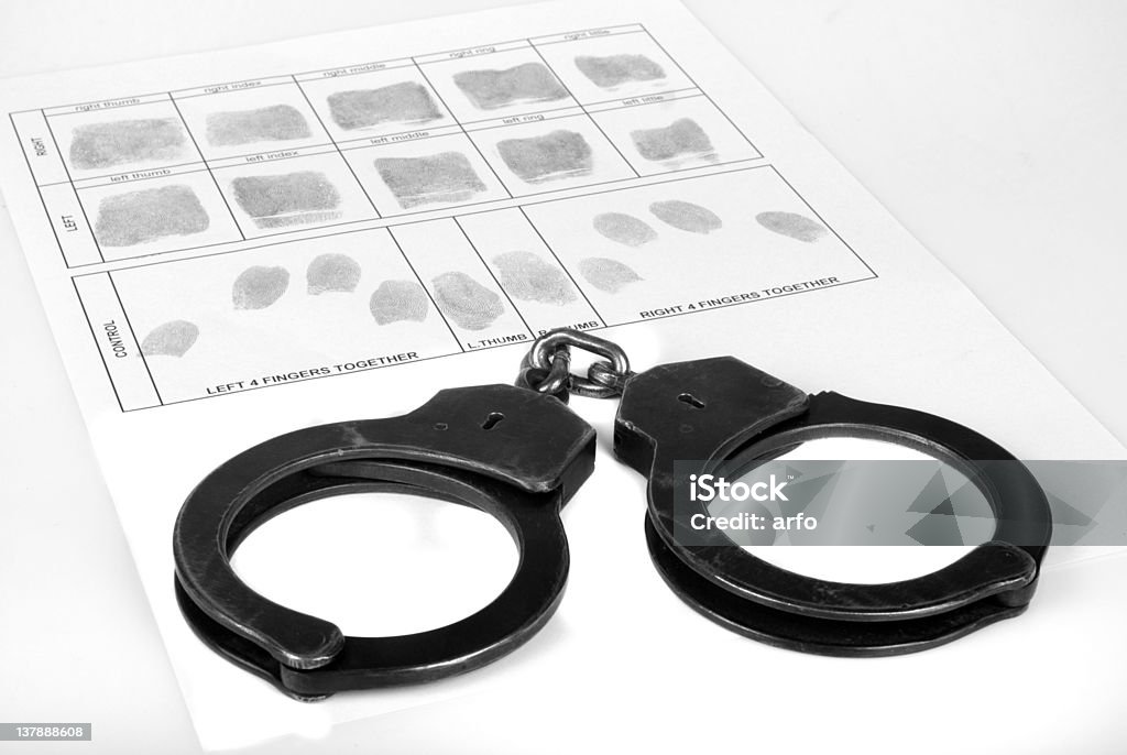 Handcuff et Empreinte digitale - Photo de Blanc libre de droits