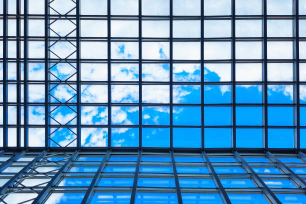 istock Office building against the sky. Skyscraper bottom view. Ascetic architecture, minimalistic design. Business background concept on sky background 1378888109