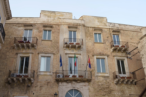 Taranto, Italy - June 23, 2021: Taranto, Apulia, Italy: exterior of historic palace along the coast
