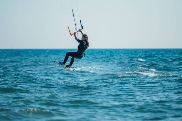 istock Woman kitesurfing on the ocean waters 1378914970